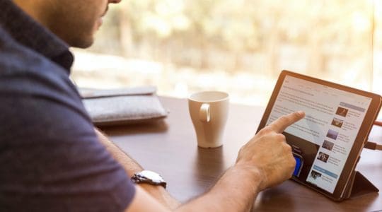 man holding tablet computer